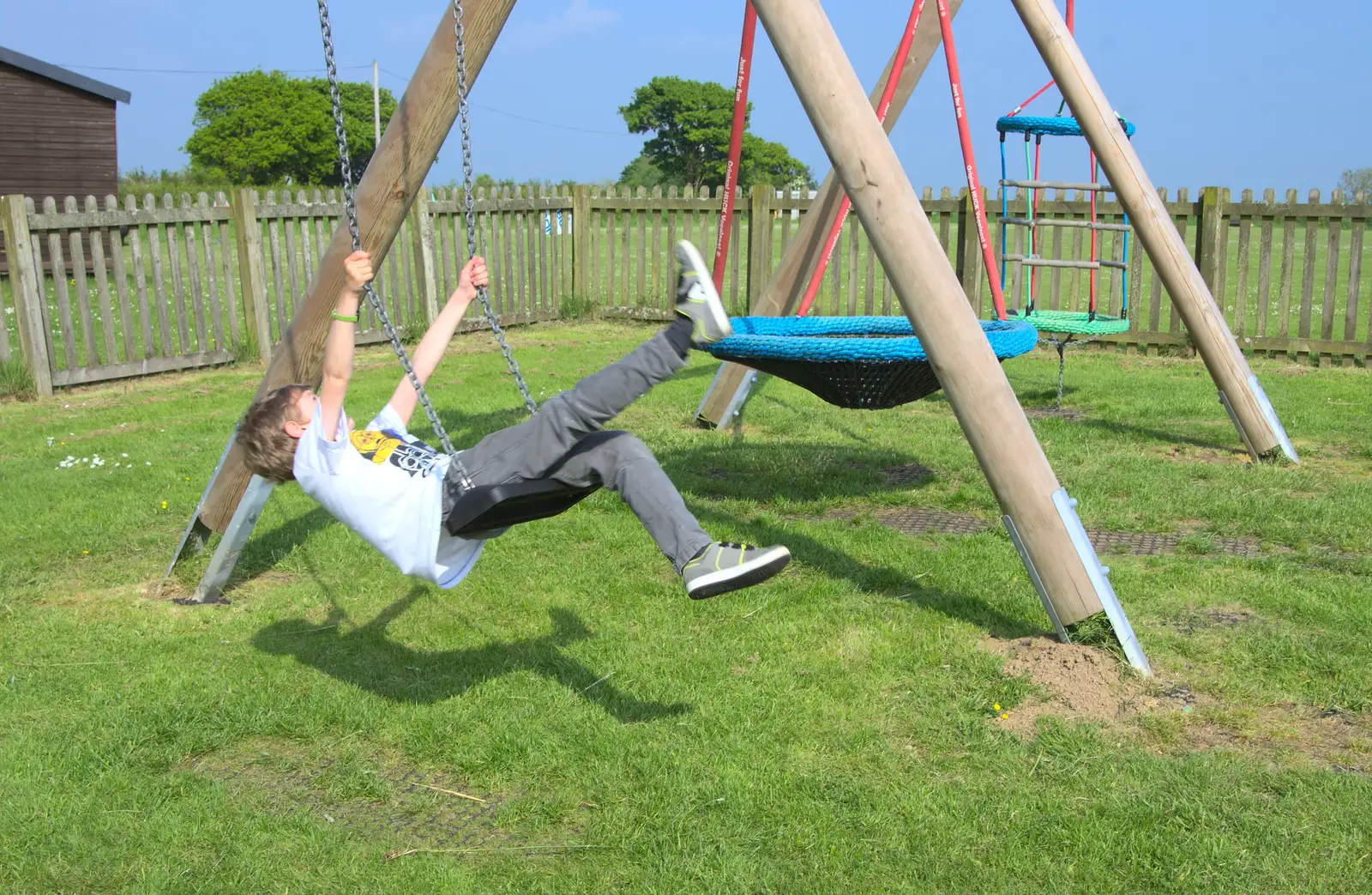 Fred on the swings, from A Visit to Okehampton Castle and Dartmoor, Devon  - 28th May 2016