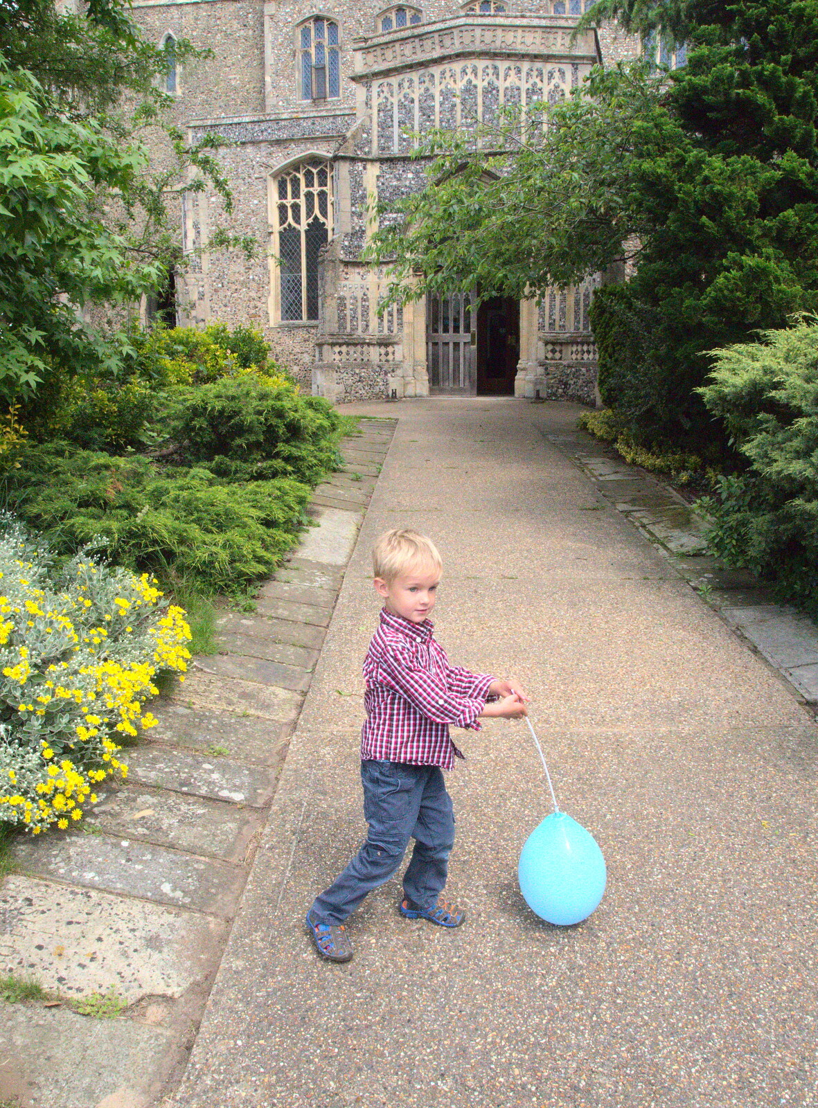 Harry and his balloon outside the church from A Trip to Norwich and Diss Markets, Norfolk - 25th June 2016