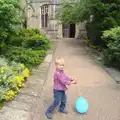 Harry and his balloon outside the church, A Trip to Norwich and Diss Markets, Norfolk - 25th June 2016