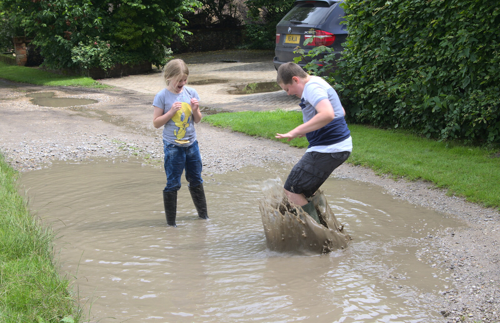 Matthew jumps into puddles from Thrandeston Pig, Little Green, Thrandeston, Suffolk - 26th June 2016