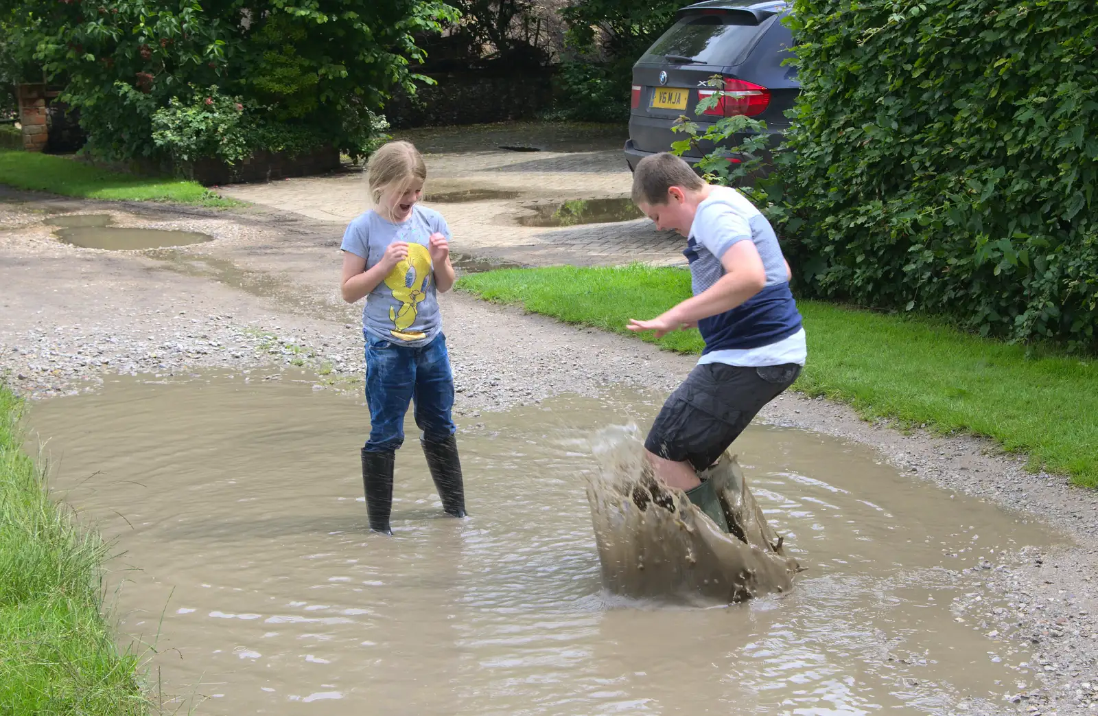 Matthew jumps into puddles, from Thrandeston Pig, Little Green, Thrandeston, Suffolk - 26th June 2016