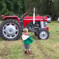 Harry wanders off to look at tractors, Thrandeston Pig, Little Green, Thrandeston, Suffolk - 26th June 2016