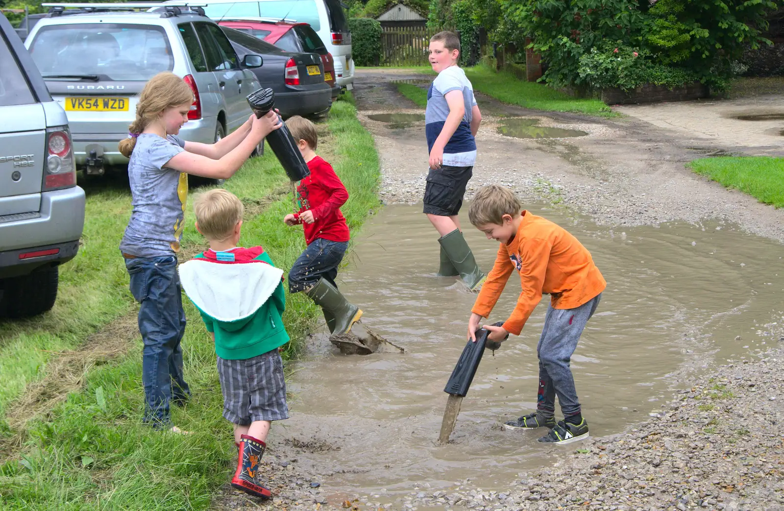 Wellington boots are emptied out, from Thrandeston Pig, Little Green, Thrandeston, Suffolk - 26th June 2016