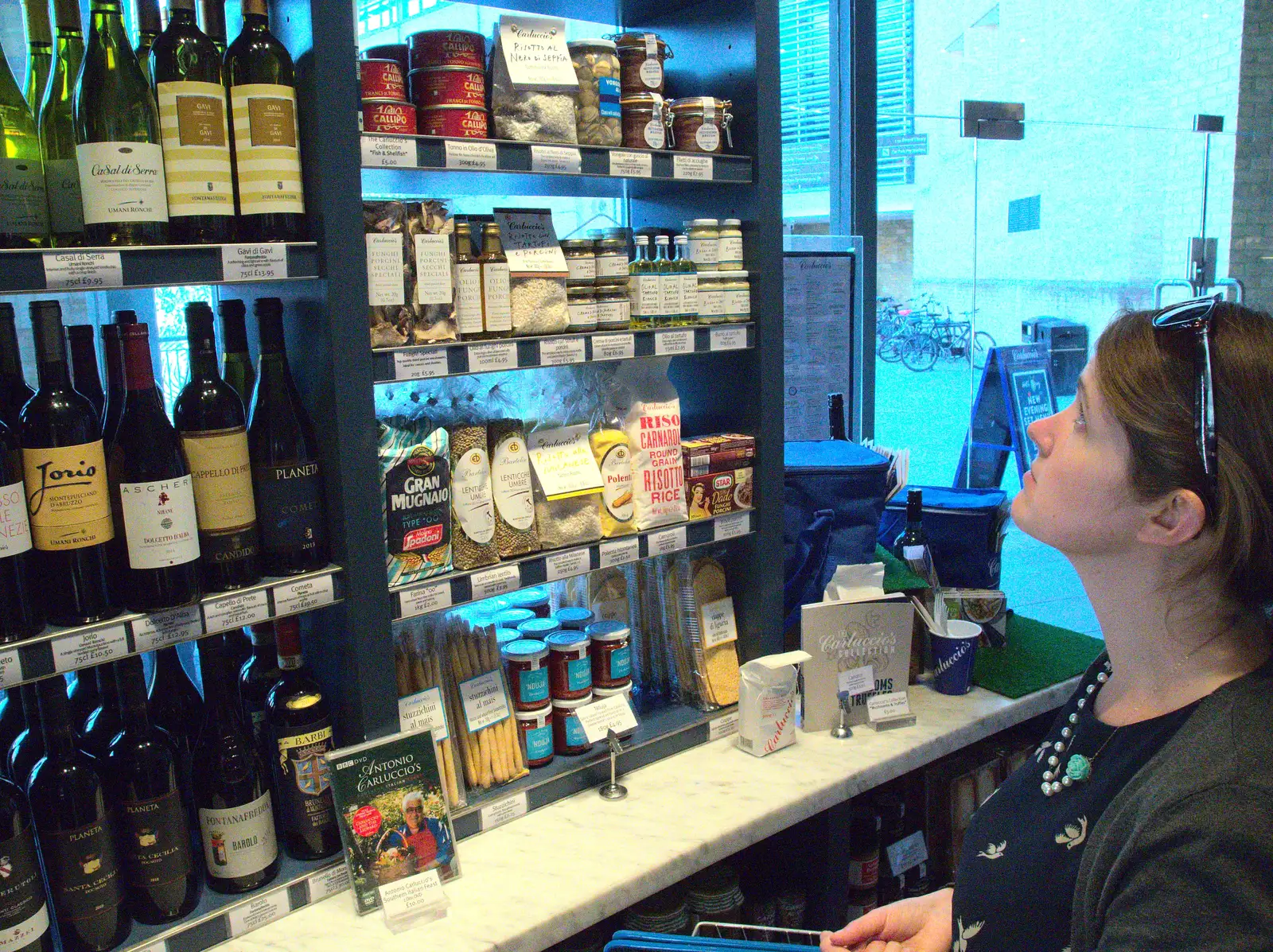 Isobel inspects the food in Carluccio's, from Back in the 'Bridge: an Anniversary, Cambridge - 3rd July 2016