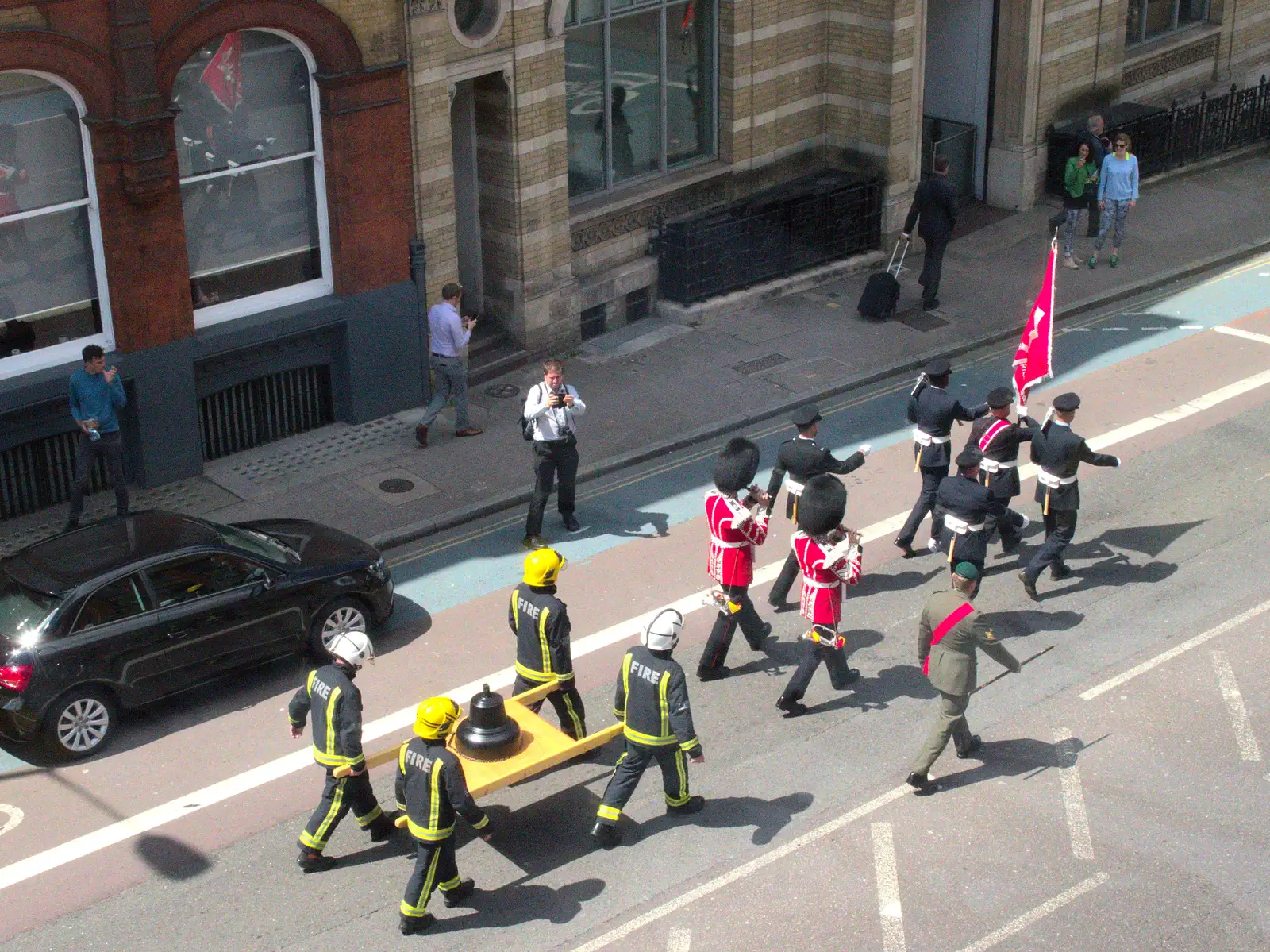 The parade moves past the old library, from Harry's Sports Day and a London March, Southwark and Eye, Suffolk - 7th July 2016