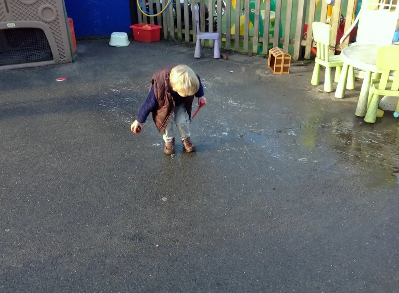 Harry jumps around in the wet playground, from Harry's Nursery Life, Mulberry Bush, Eye, Suffolk - 8th July 2016