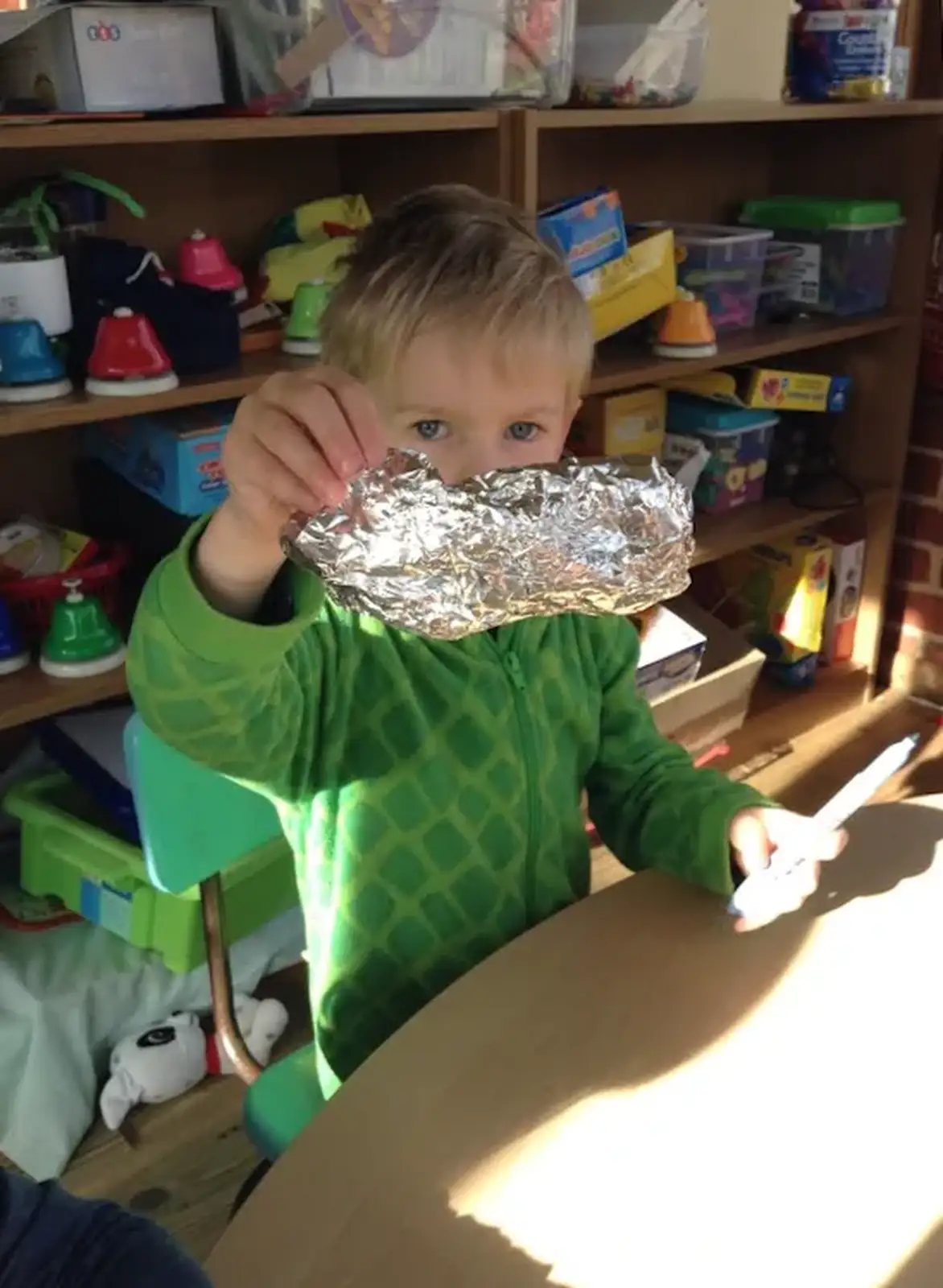 Harry holds up a bit of silver foil, from Harry's Nursery Life, Mulberry Bush, Eye, Suffolk - 8th July 2016