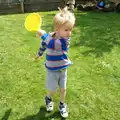 Harry has a swing with a small tennis racquet, Harry's Nursery Life, Mulberry Bush, Eye, Suffolk - 8th July 2016