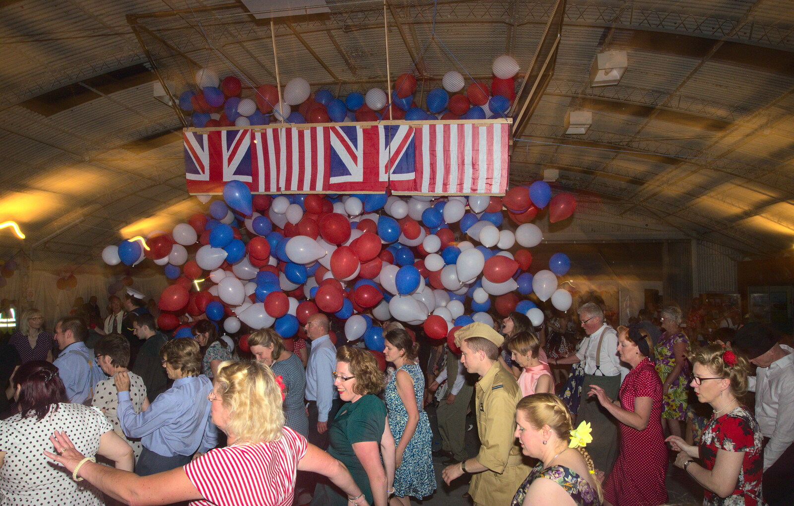 The balloons are unleashed from "Our Little Friends" Warbirds Hangar Dance, Hardwick, Norfolk - 9th July 2016