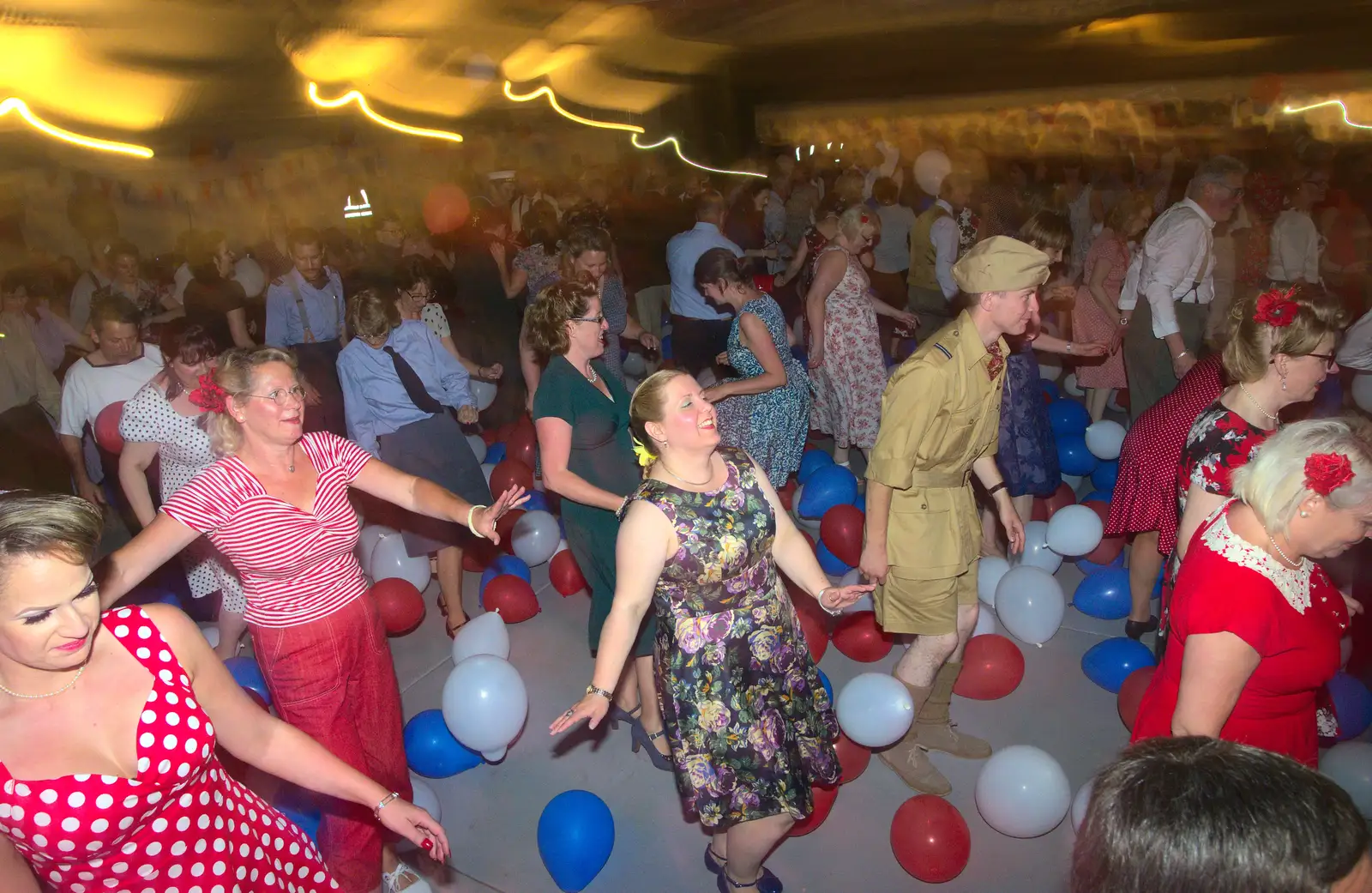 Some kind of 1940s line-dancing is going on, from "Our Little Friends" Warbirds Hangar Dance, Hardwick, Norfolk - 9th July 2016