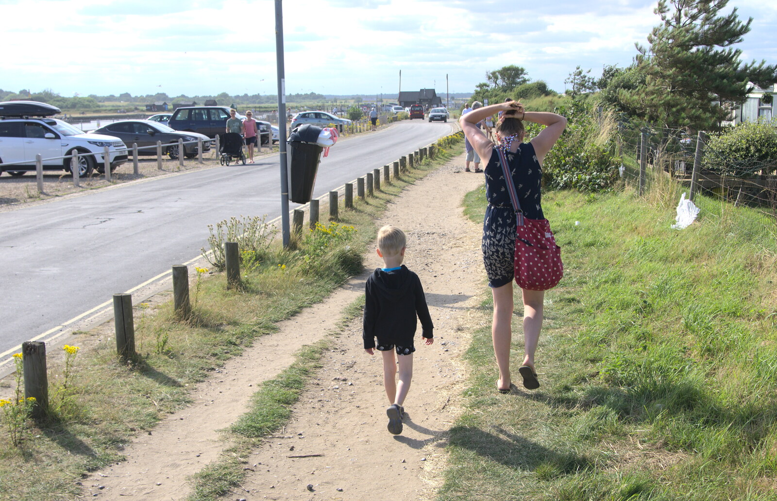 Harry and Isobel walk along the harbour road from A Short Trip to Southwold, Suffolk - 24th July 2016