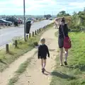 Harry and Isobel walk along the harbour road, A Short Trip to Southwold, Suffolk - 24th July 2016