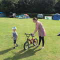 Camping in West Runton, North Norfolk - 30th July 2016, Isobel gets Harry's bike ready