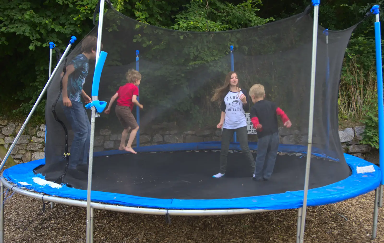 The children bounce around on a trampoline, from Camping With Sean, Ashburton, Devon - 8th August 2016