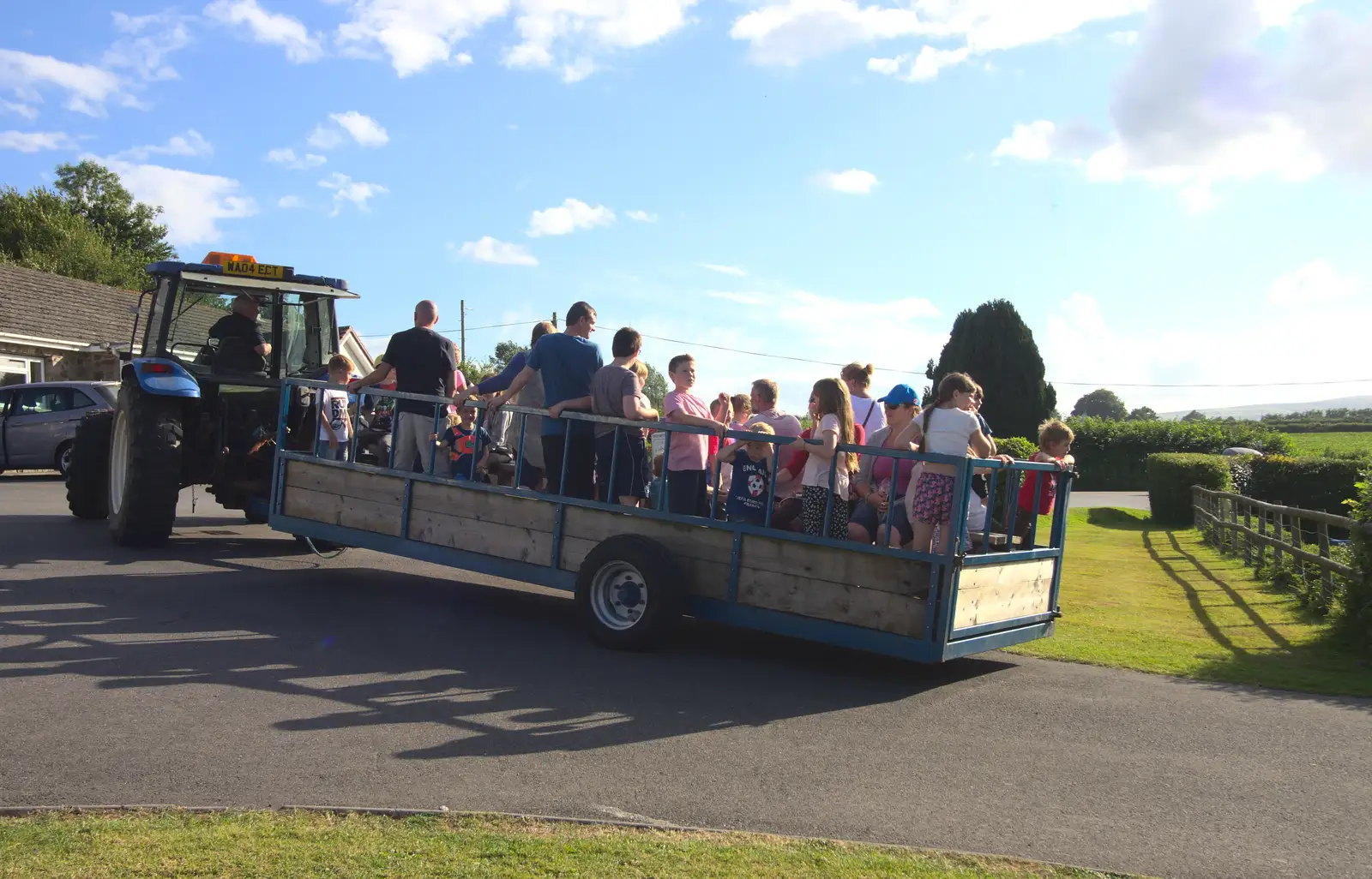 The tractor hauls the trailer off, from Camping With Sean, Ashburton, Devon - 8th August 2016