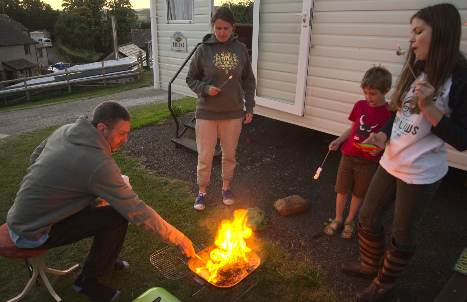 Sean pokes the fire from Camping With Sean, Ashburton, Devon - 8th August 2016