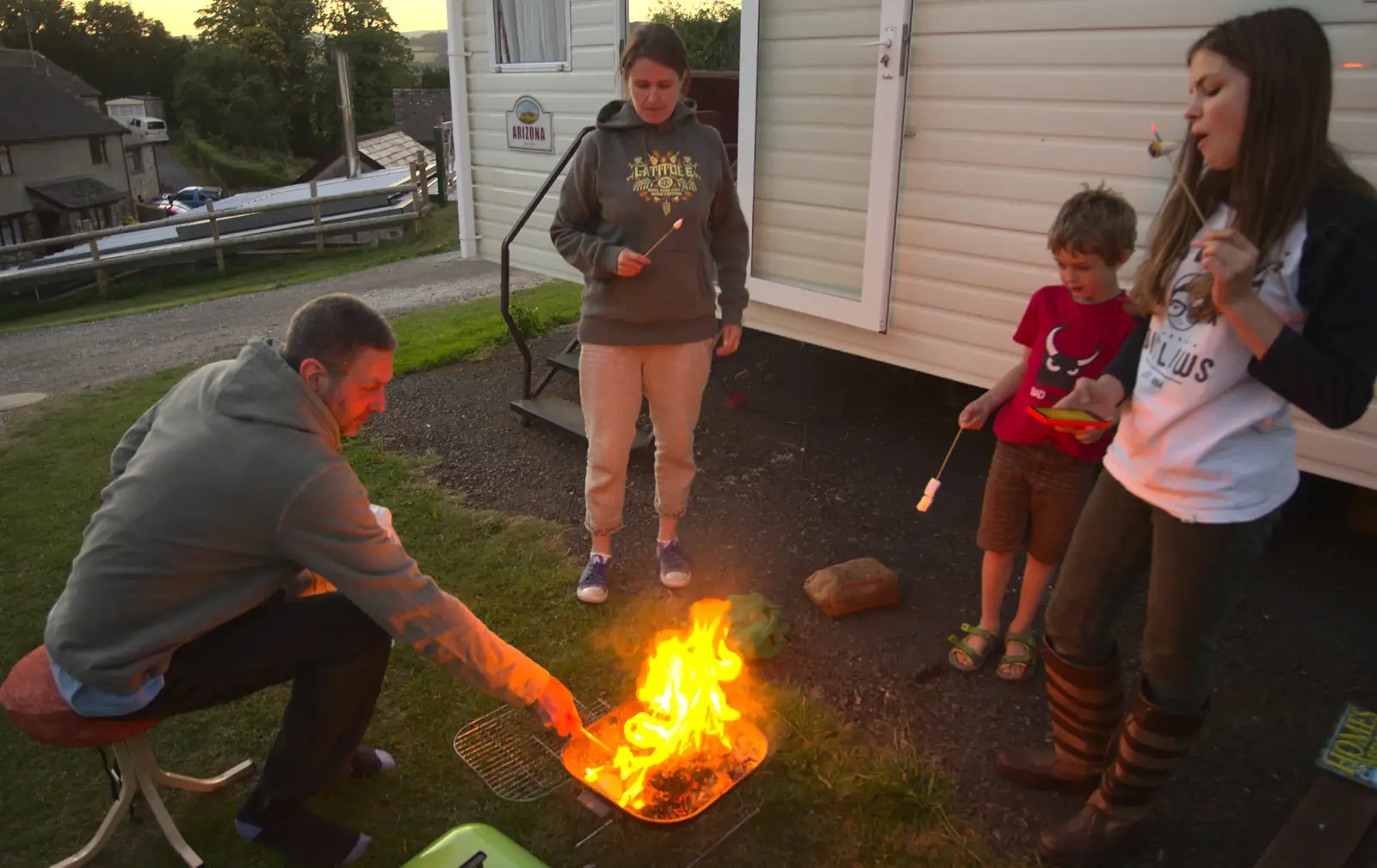 Sean pokes the fire, from Camping With Sean, Ashburton, Devon - 8th August 2016