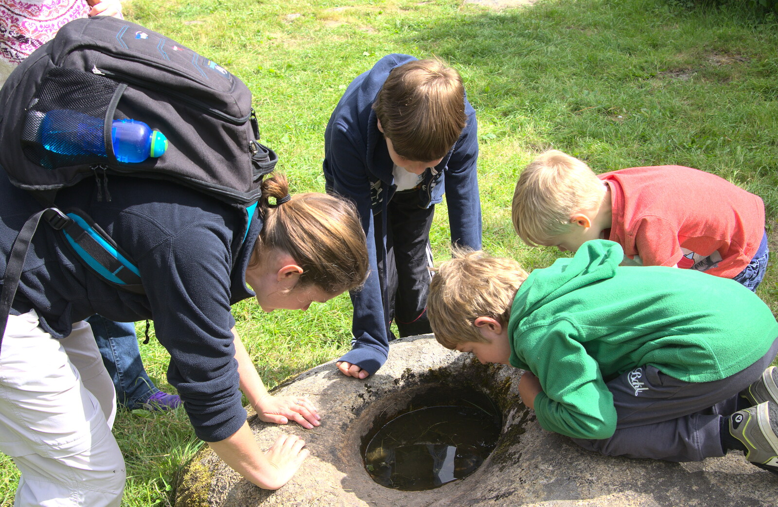 Everyone peers into a puddle of water from Camping With Sean, Ashburton, Devon - 8th August 2016