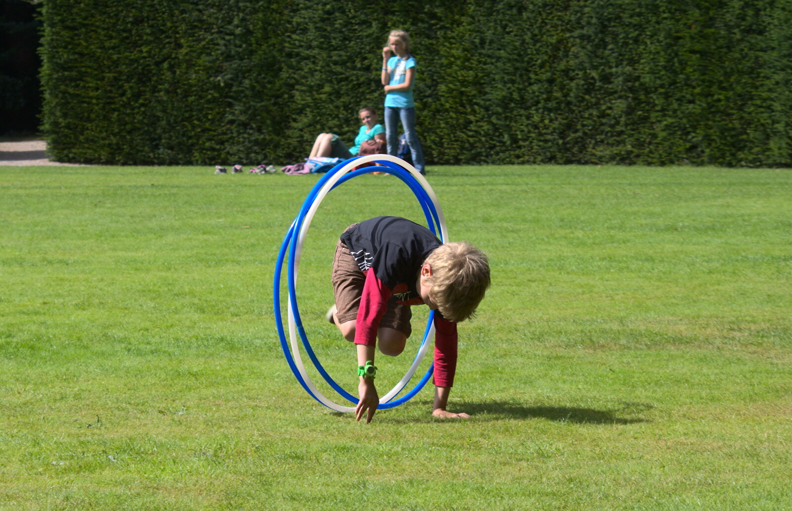 Fred hurls himself through moving hula-hoops from The Tom Cobley and Castle Drogo, Spreyton and Drewsteignton, Devon - 11th August 2016