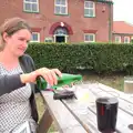 Isobel pours a fizzy water, A Trip to Waxham Sands,  Horsey, Norfolk - 27th August 2016