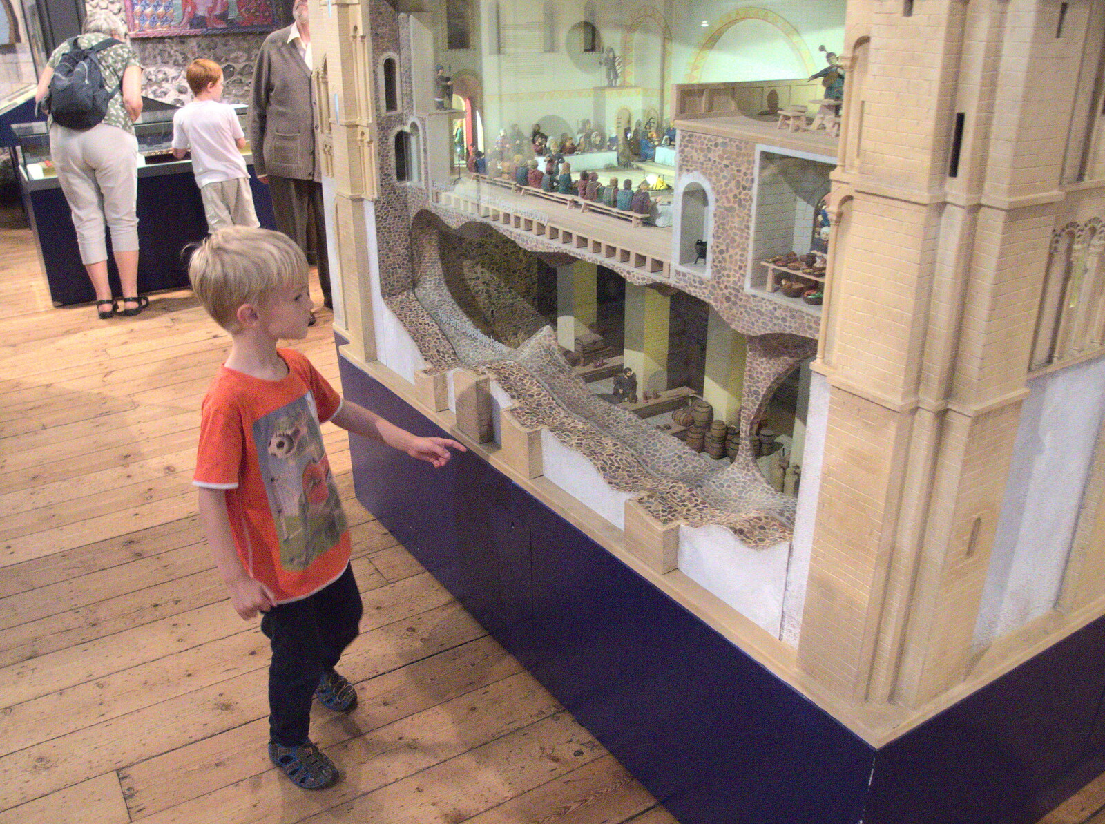 Swordfights at Norwich Castle, Norwich, Norfolk - 31st August 2016: Harry looks at a model of the castle