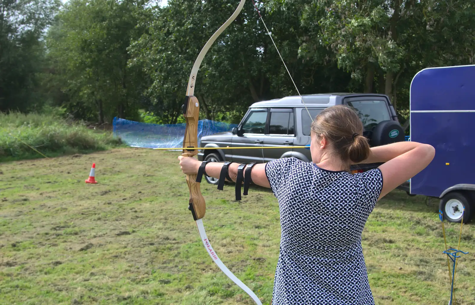 Isobel lets another arrow loose, from The Eye Scouts Duck Race, The Pennings, Eye, Suffolk - 24th September 2016