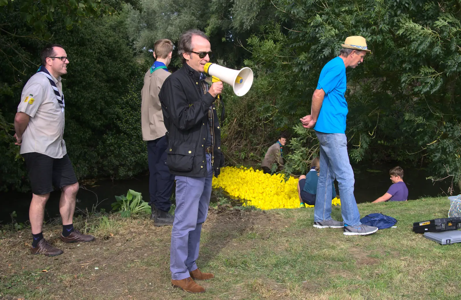 Local estate-agent Simon Harrison starts the race, from The Eye Scouts Duck Race, The Pennings, Eye, Suffolk - 24th September 2016