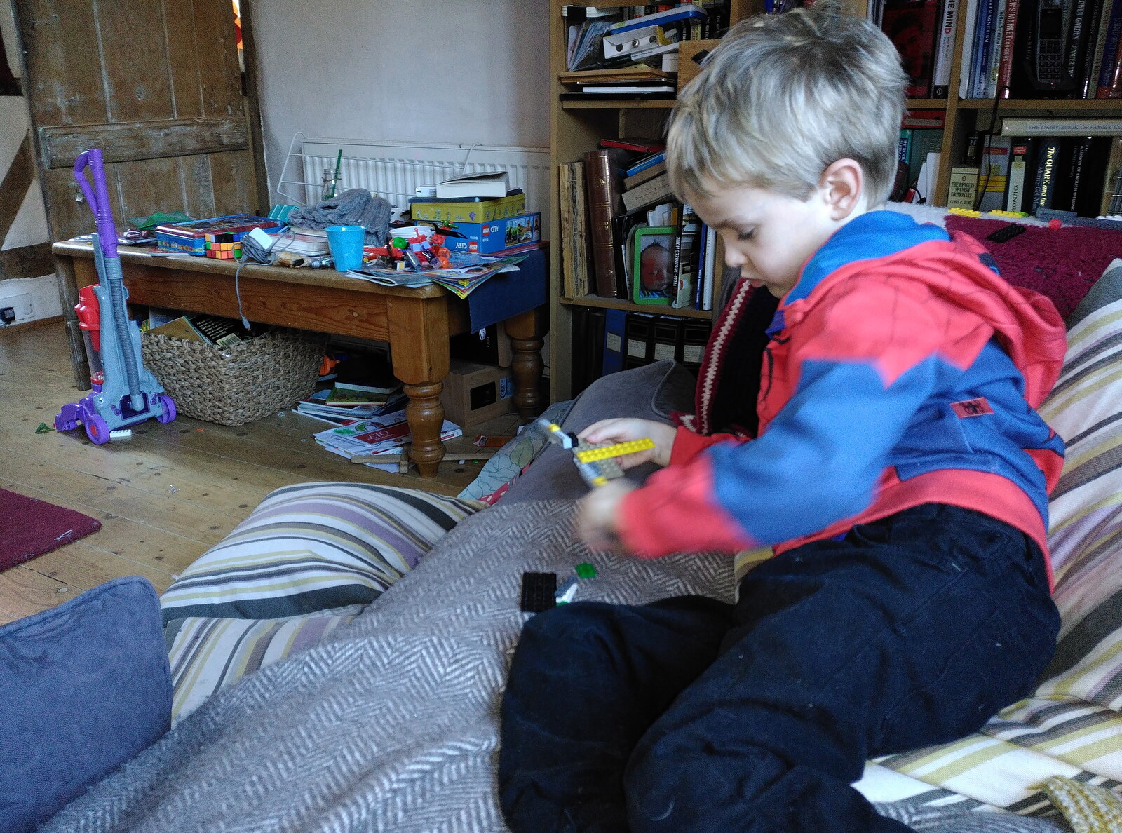 Harry plays with Lego on the sofa from Tractor Rides and Pub Cellars, Brome, Suffolk - 29th October 2016