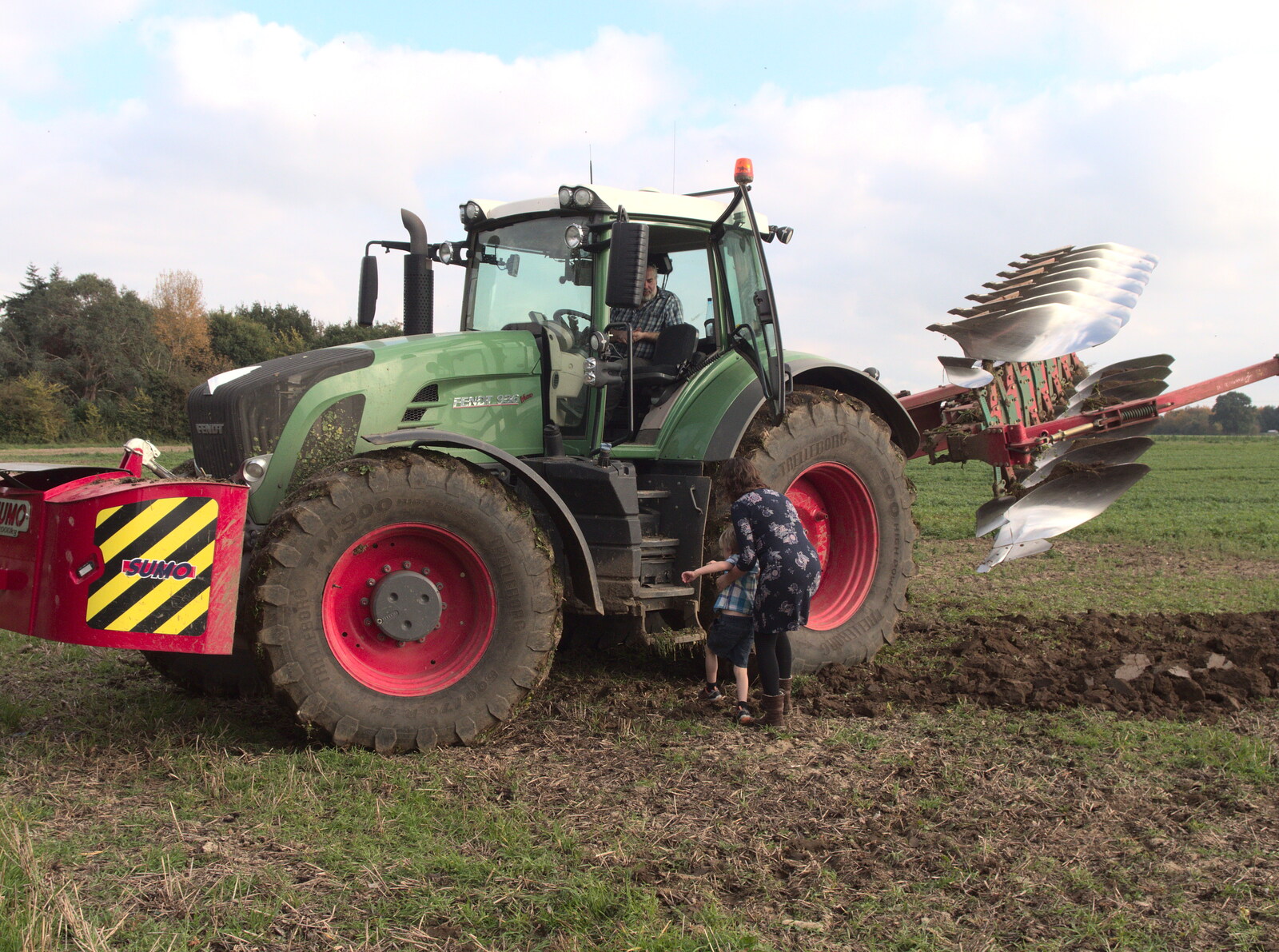 Isobel and Harry climb up to the tractor cab from Tractor Rides and Pub Cellars, Brome, Suffolk - 29th October 2016