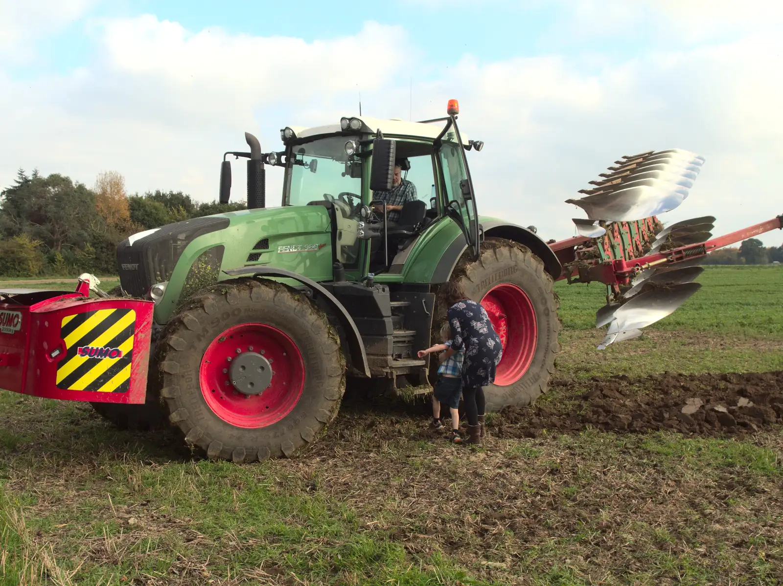 Isobel and Harry climb up to the tractor cab, from Tractor Rides and Pub Cellars, Brome, Suffolk - 29th October 2016