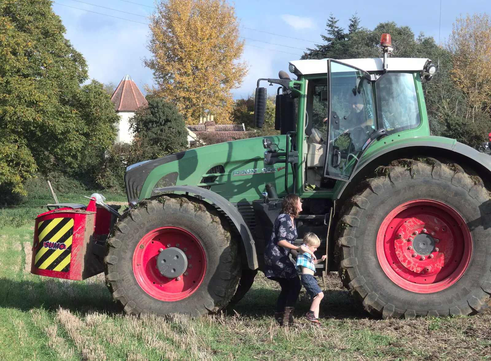 Harry gets out of the tractor, from Tractor Rides and Pub Cellars, Brome, Suffolk - 29th October 2016