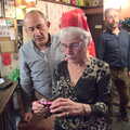Spam looks at photos, The BSCC Christmas Dinner at The Swan Inn, Brome, Suffolk - 3rd December 2016