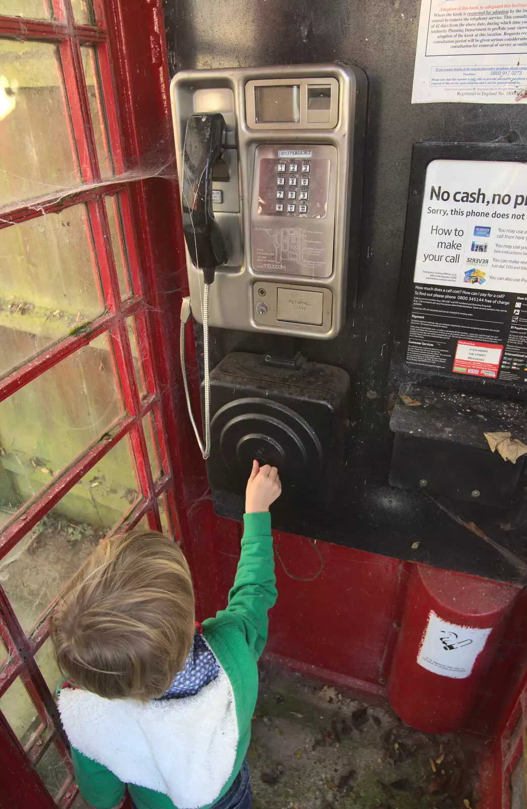 Harry pokes around in the old phone box, from Jack's Birthday and New Windows, Brome and Brockdish, Norfolk - 4th December 2016