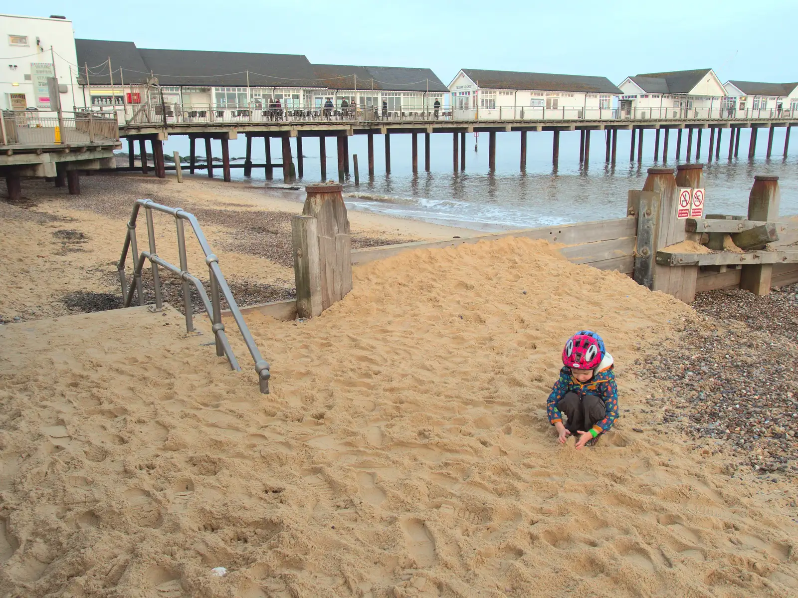 Harry pokes around in the sand, from Southwold Seaside Pier, Southwold, Suffolk - 18th December 2016