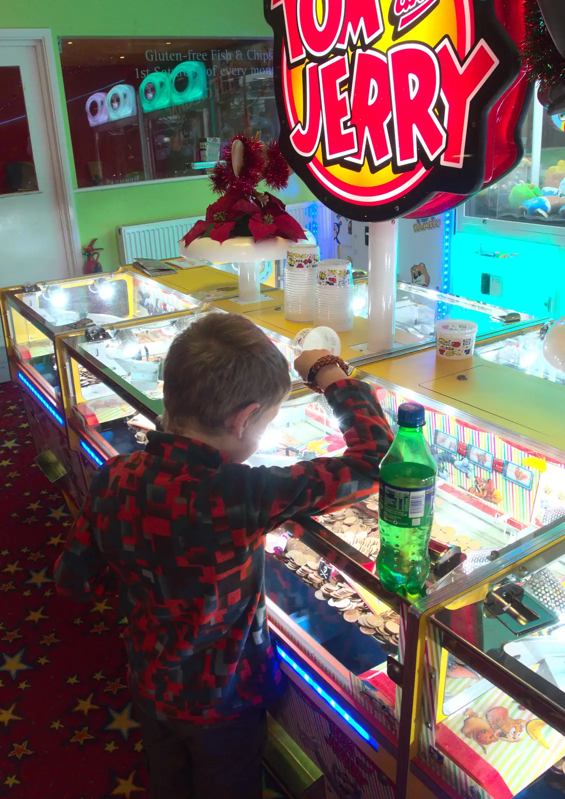 Fred does the 2p coin thing, from Southwold Seaside Pier, Southwold, Suffolk - 18th December 2016