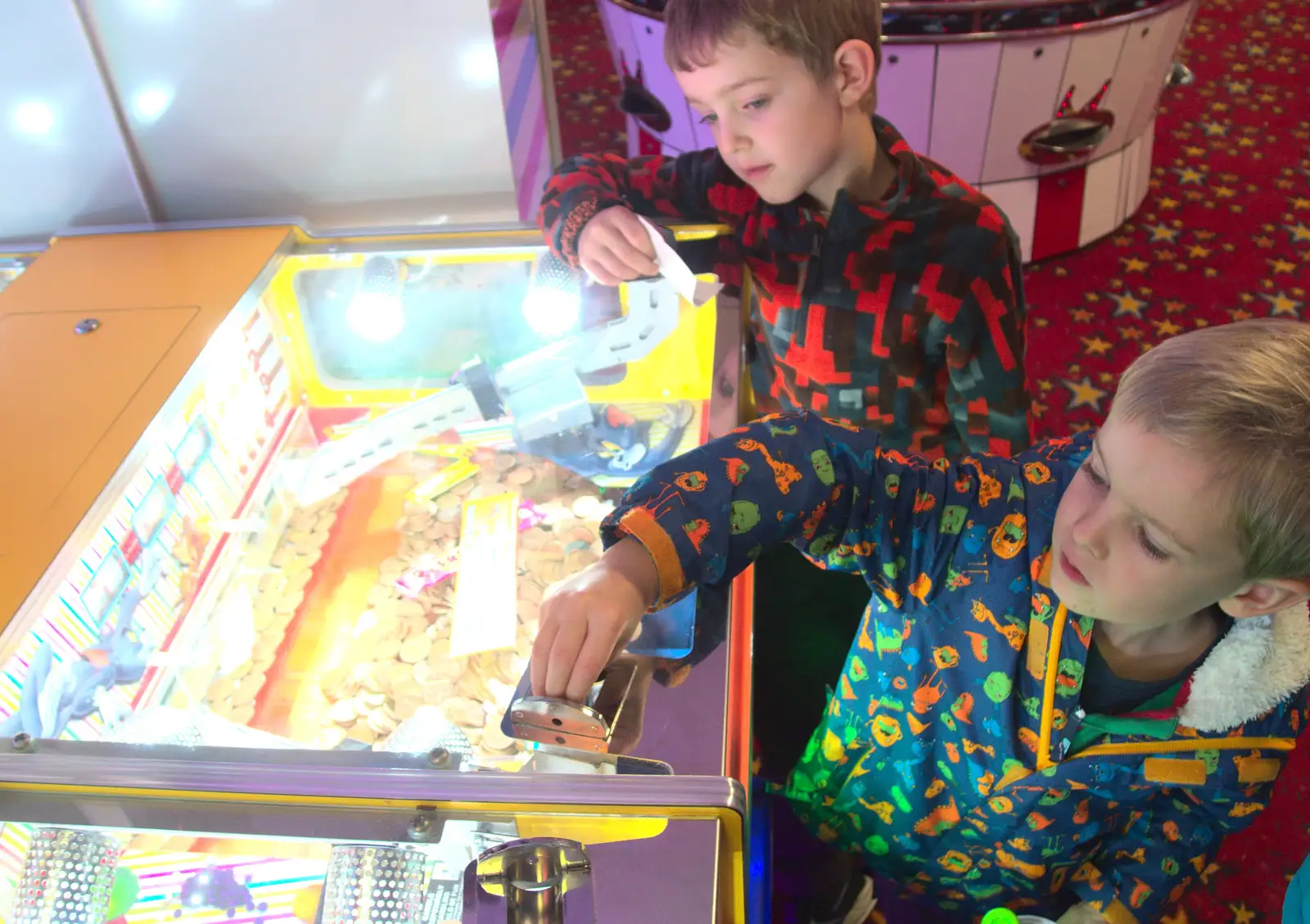 Harry feeds the machine, from Southwold Seaside Pier, Southwold, Suffolk - 18th December 2016