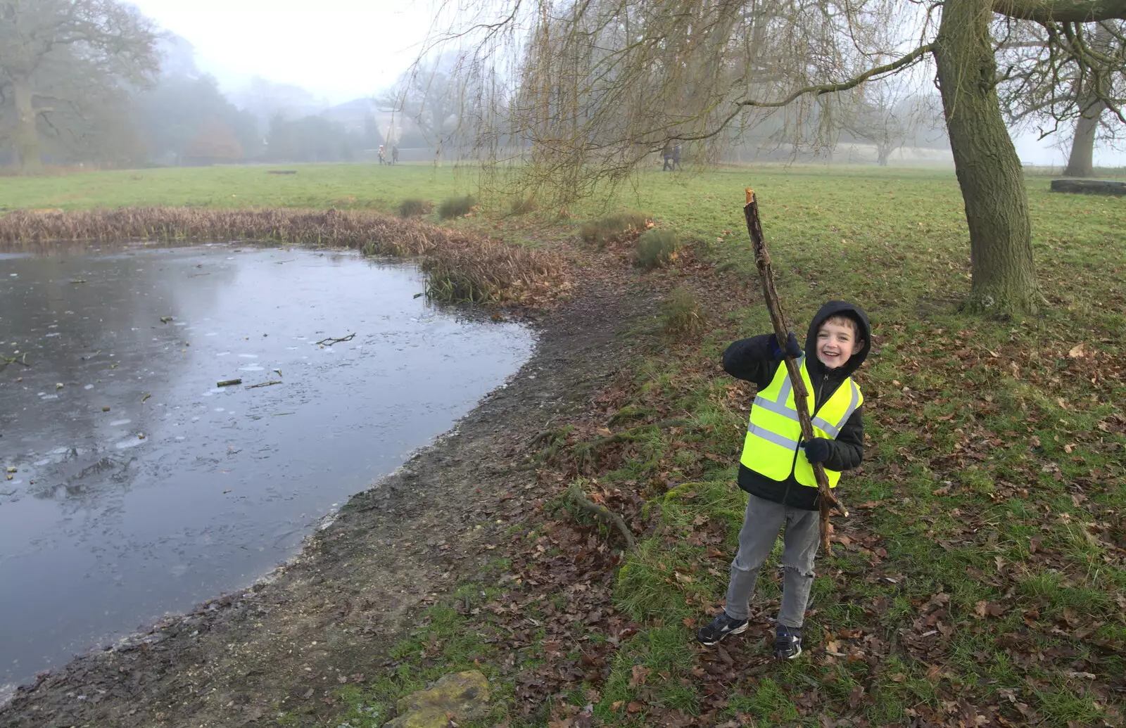 Fred finds a big stick to hurl into the pond, from A Trip to Ickworth House, Horringer, Suffolk - 30th December 2016