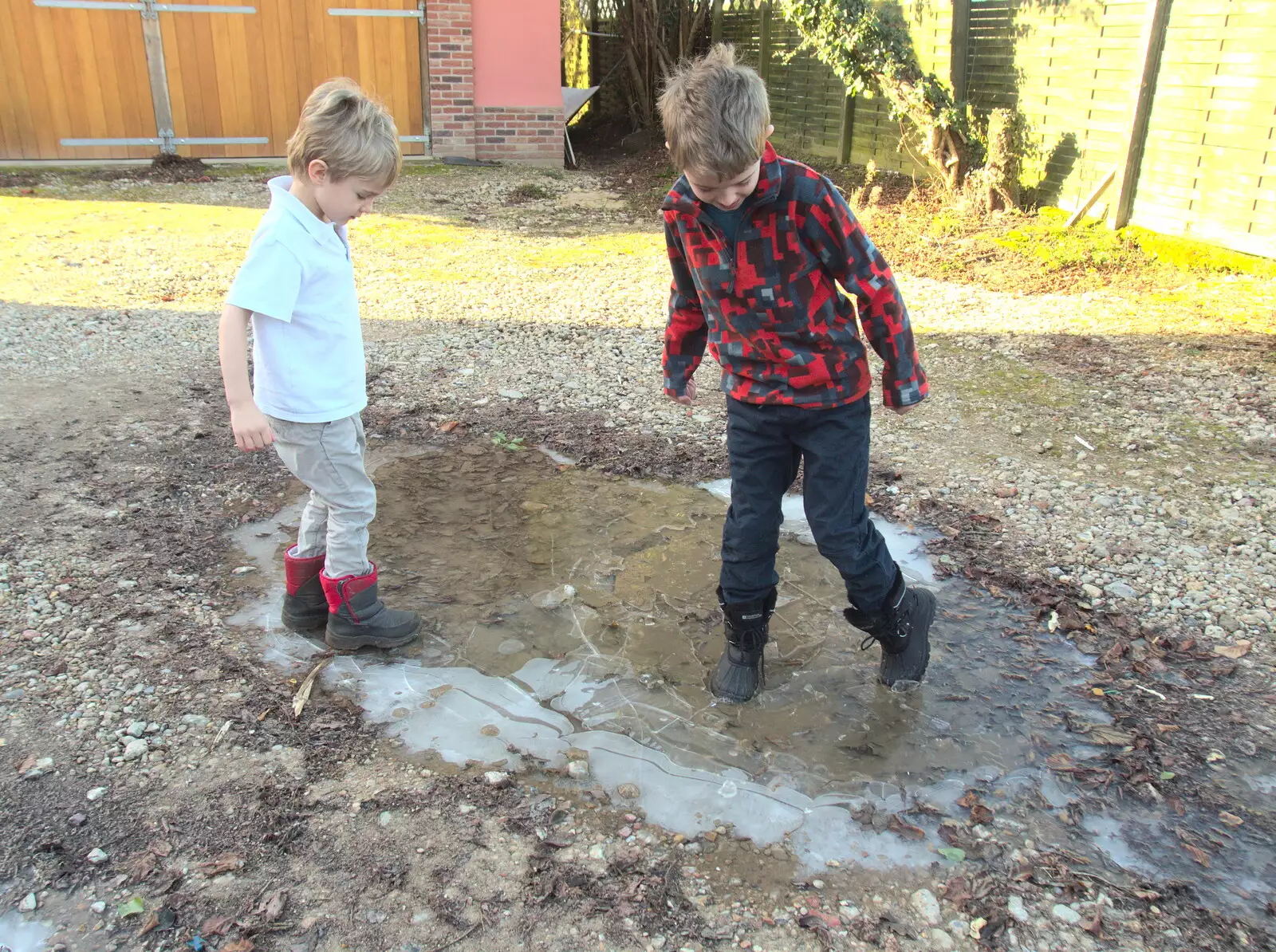 Harry and Fred are having fun breaking up the ice, from A Snowy January Miscellany, Eye, Suffolk - 15th January 2017