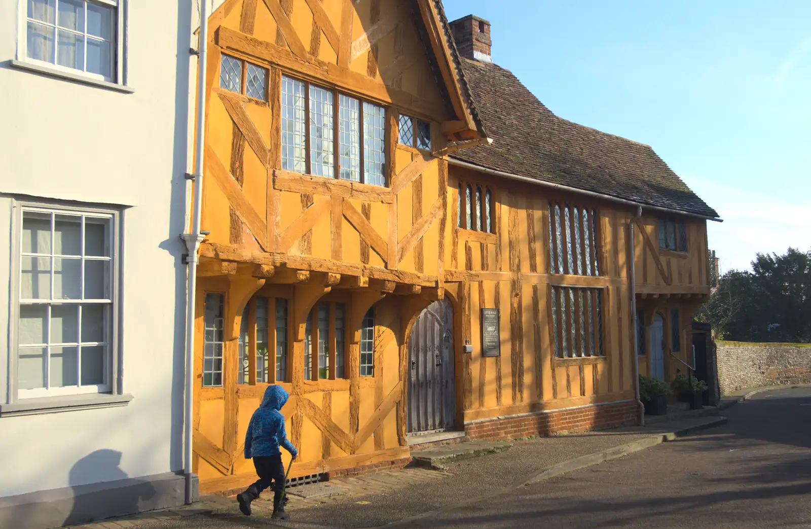 Fred walks past the very orange Little Hall, from A Day in Lavenham, Suffolk - 22nd January 2017