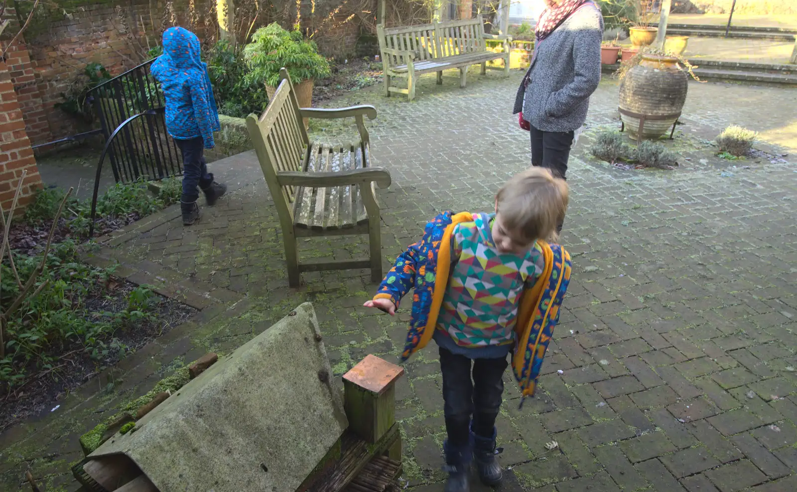 Harry pokes at something, from A Day in Lavenham, Suffolk - 22nd January 2017