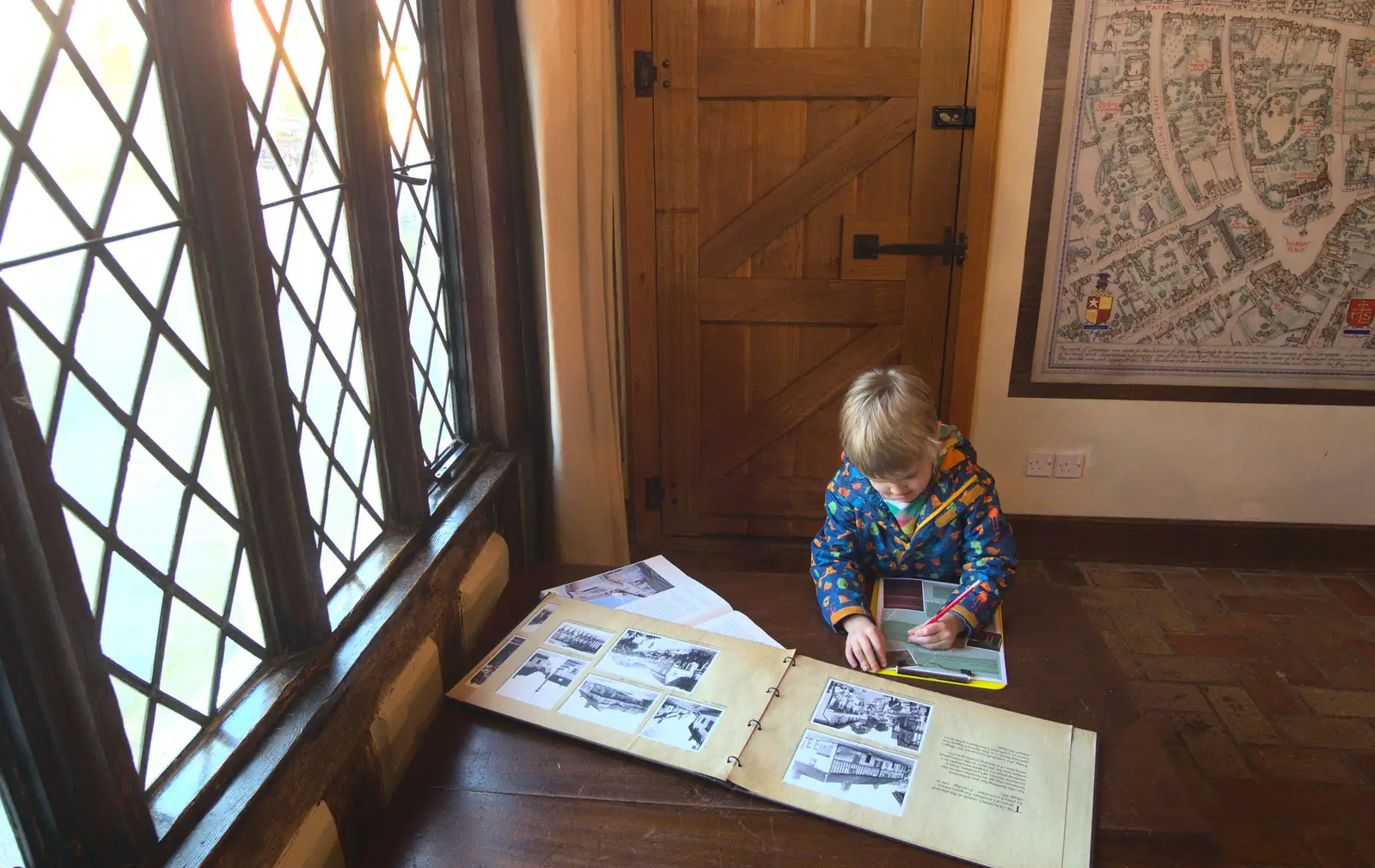 Harry writes something down, from A Day in Lavenham, Suffolk - 22nd January 2017