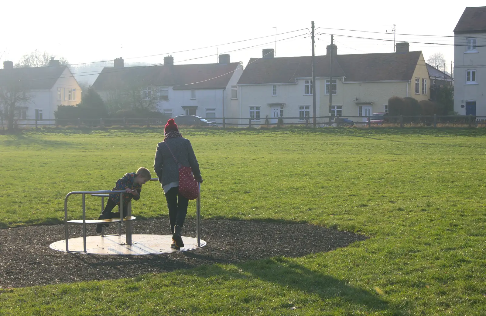 Harry and Isobel on a roundabout, from A Day in Lavenham, Suffolk - 22nd January 2017