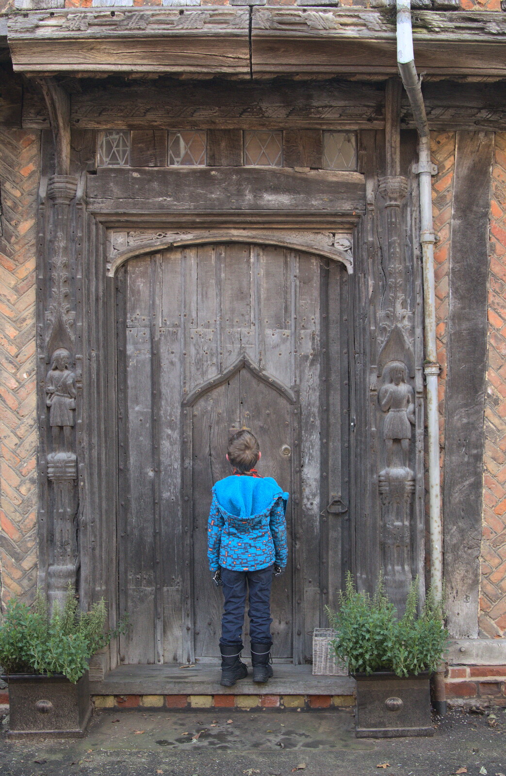 Fred inspects a door within a door from A Day in Lavenham, Suffolk - 22nd January 2017