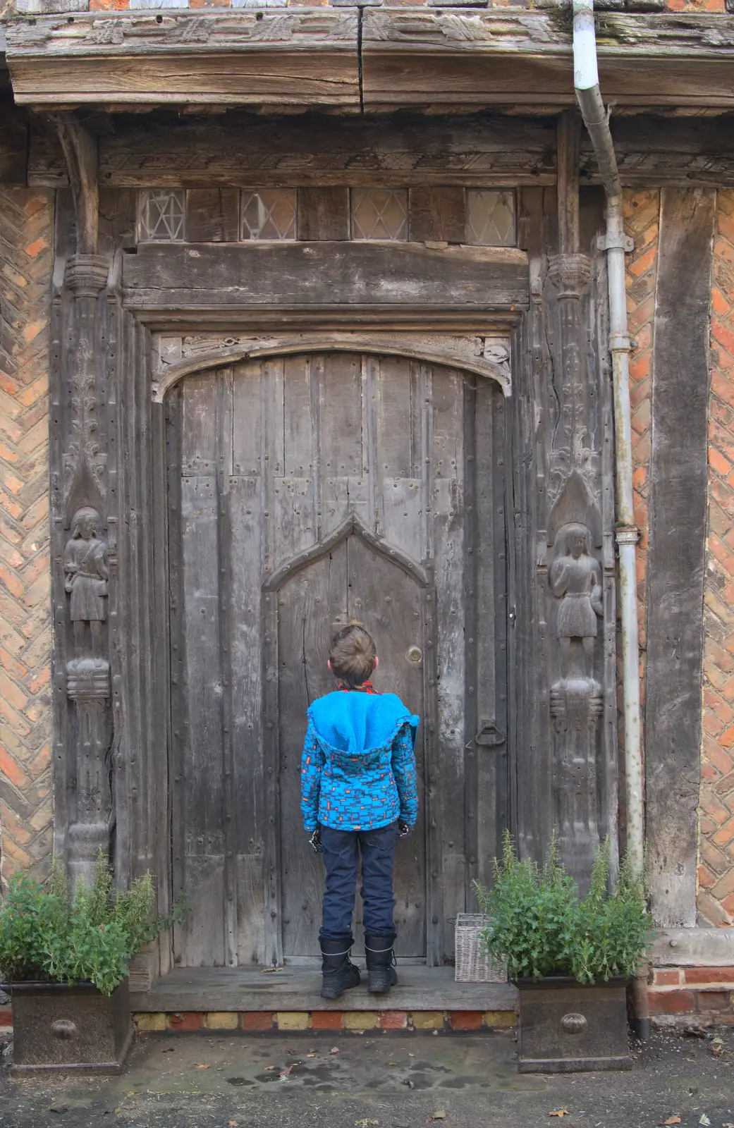 Fred inspects a door within a door, from A Day in Lavenham, Suffolk - 22nd January 2017