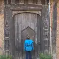 Fred inspects a door within a door, A Day in Lavenham, Suffolk - 22nd January 2017