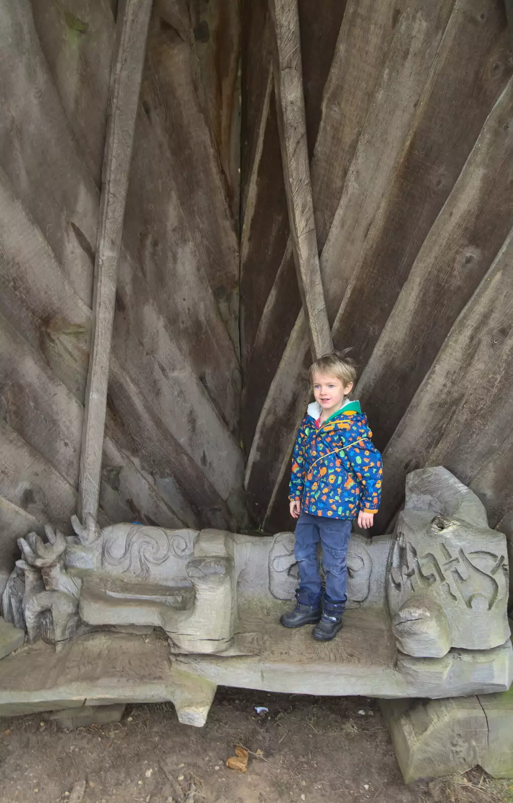 Harry stands on a seat covered up with half a boat, from A Trip to Sutton Hoo, Woodbridge, Suffolk - 29th January 2017