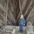 Harry stands on a seat covered up with half a boat, A Trip to Sutton Hoo, Woodbridge, Suffolk - 29th January 2017