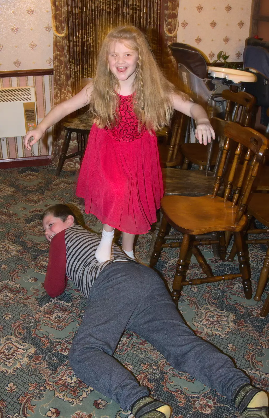 Jessica stomps on her brother, from Sylvia's 70th Birthday up the Swan Inn, Brome, Suffolk - 11th February 2017