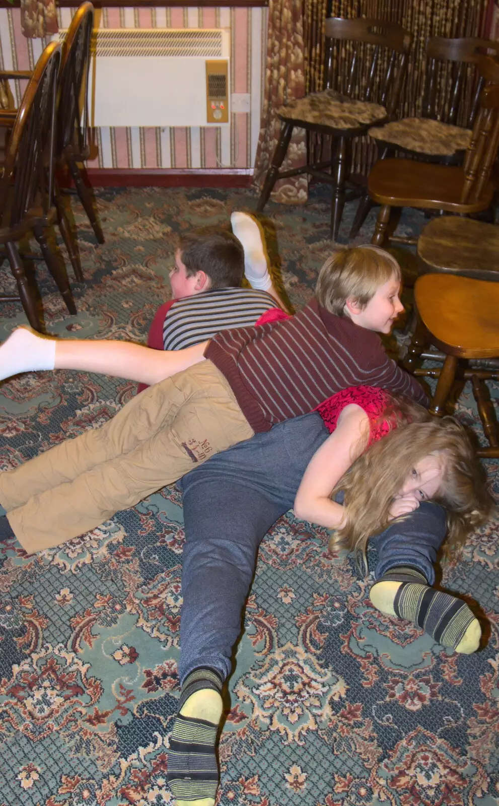 Oak and Jessica pile on Matthew, from Sylvia's 70th Birthday up the Swan Inn, Brome, Suffolk - 11th February 2017