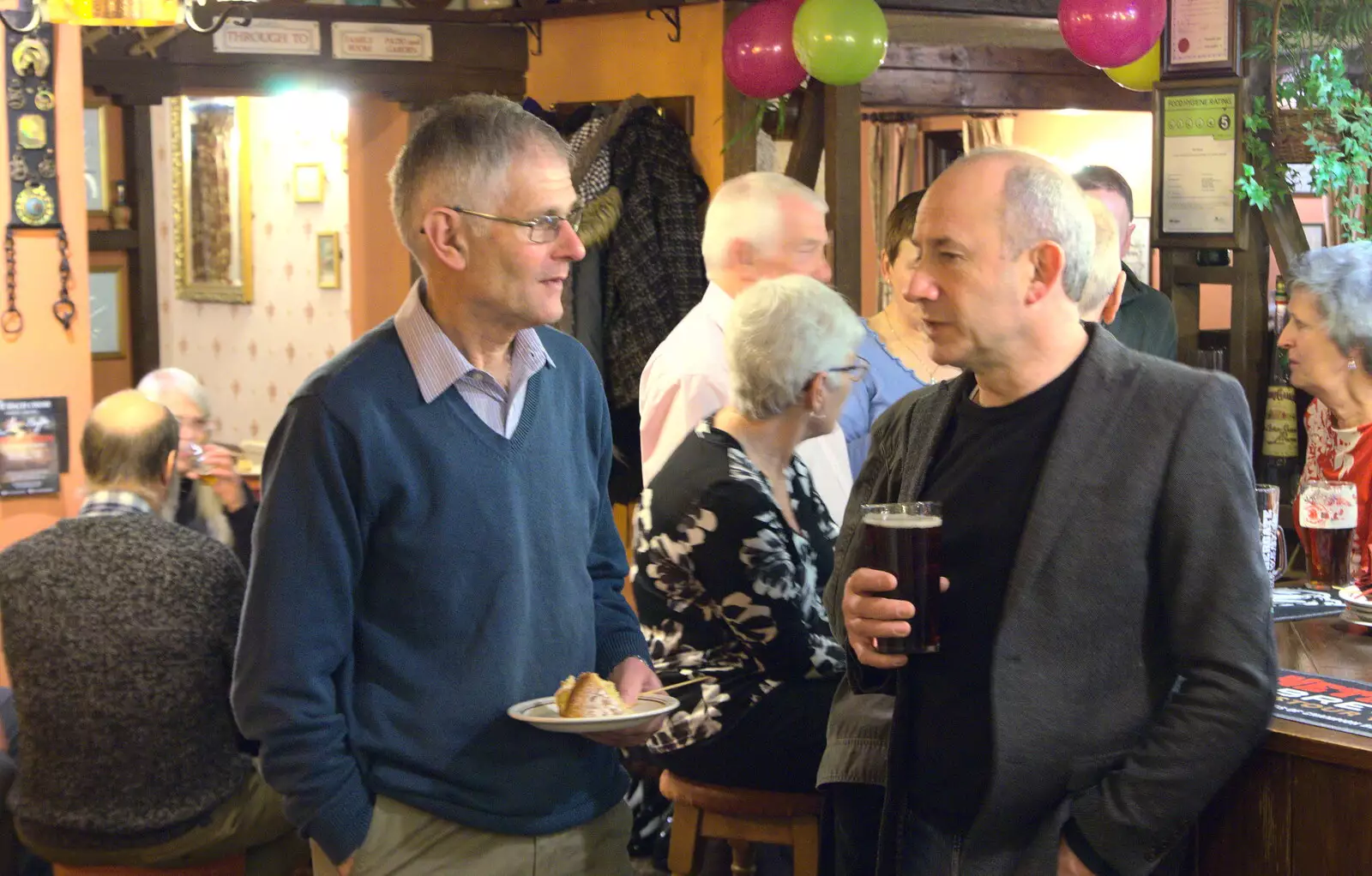 Uncle Mick talks to DH, from Sylvia's 70th Birthday up the Swan Inn, Brome, Suffolk - 11th February 2017